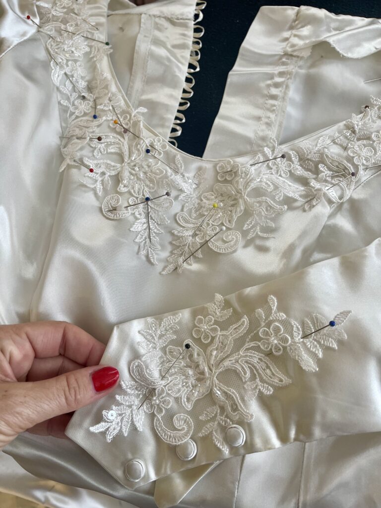 Delicate floral lace pinned onto the original pointed cuff of Fiona’s heirloom wedding dress