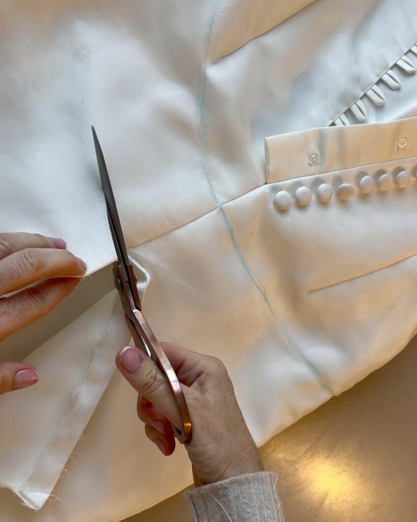 Cutting through Roxy’s mum’s wedding dress to reposition the original mermaid skirt