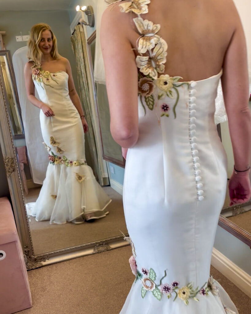Roxy wearing her mum’s original wedding dress before the heirloom redesign